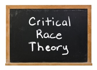 Obraz premium Critical race theory written in white chalk on a black chalkboard isolated on white