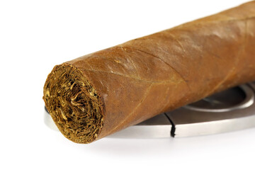Cigar with guillotine isolated on a white background