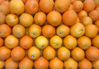 Oranges. Fresh subtropical fruits for sale on farmers market