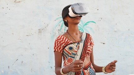 Closeup shot of a pretty Indian female wearing the virtual reality glasses