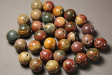 Beads made of natural jasper stone. To create jewelry and rosaries.