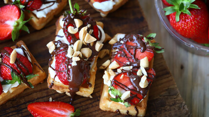 Waffles with cream cheese and strawberries. Healthy breakfast or dessert.