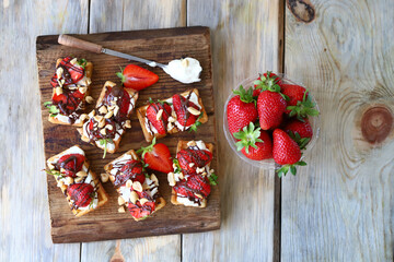 Waffles with cream cheese and strawberries. Healthy breakfast or dessert.