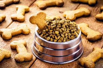 dog biscuits in the shape of a bone with a jar of food, dog snacks in a rustic setting, pet-fed cone