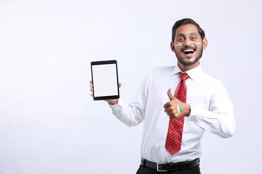 Independence day offer concept : Young indian showing smartphone. - Powered by Adobe