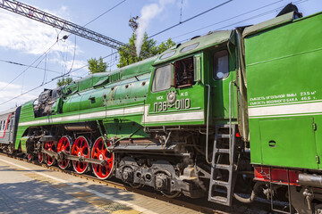 Green retro steam locomotive on the railway platform of the Rizhsky station. Moscow, Russia