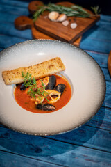 Italian cioppino seafood soup with toasts