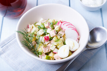 Okroshka with kvass and sausage. Traditional classic cold Russian soup. Close-up.