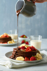 chocolate pancakes with banana and strawberry