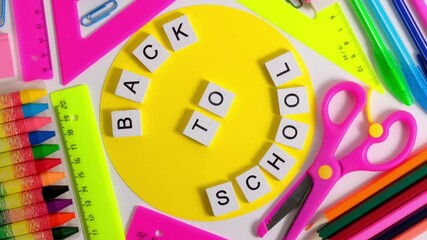 4K. Spinning of Colorful School Stationery. Back to school Education concept. School pupil Stationery. School office supplies on white background. 360 degree rotation. Top view, Flat Lay