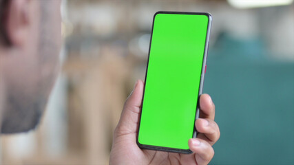 Close up of African Hands Browsing Smartphone with Green Screen