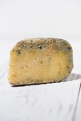 piece of fresh delicious blue cheese, vertical