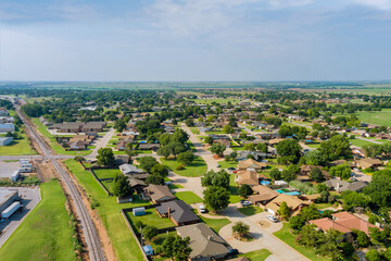 Panorama landscape scenic aerial view of a suburban settlement in a beautiful detached houses the Clinton town Oklahoma USA