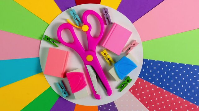 4K. Spinning of Colorful School Stationery. Back to school Education concept. School pupil Stationery. School office supplies on Colorful paper background. 360 degree rotation. Top view, Flat Lay