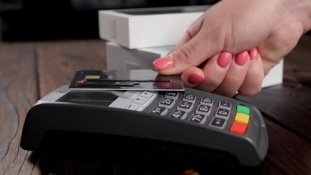 Close-up of paying an invoice or a purchase with a credit card.