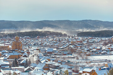 Russian Village in winter. Mountain view of a typical Russian village covered in snow