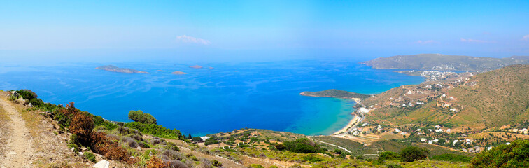 Fototapeta na wymiar Panoramic view of Agios Petros beach and Gavrio bay on Andros, famous Cycladic island, in the heart of the Aegean Sea