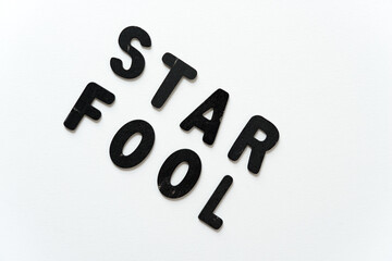 star fool in black chalk letters on white