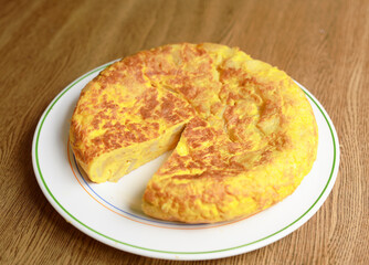 Homemade Spanish omelette on a white plate.
