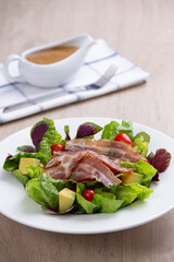 bacon salad on white dish