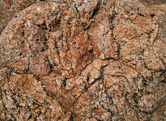Rough red stone texture. Natural grunge background. Copy space.