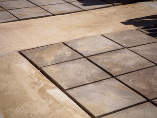 Laying patio slabs and landscaping a new outdoor floor in a garden makeover