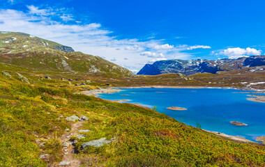 Naklejka na ściany i meble Amazing Vavatn lake panorama rough landscape boulders mountains Hemsedal Norway.