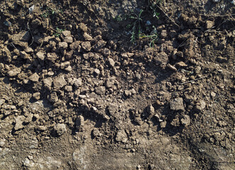 The texture of the earth, black soil, clay soil. Natural background.