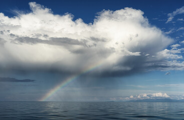 Naklejka na ściany i meble aerial view of rainbow over the sea, aerial view of Rainbow above the sea and island, aerial view of lakes on the island and rainbow