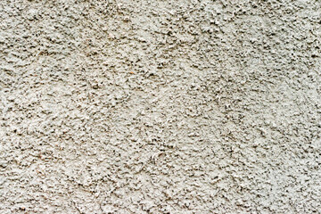 Texture of a concrete wall with cracks and scratches which can be used as a background