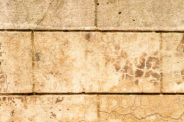 Texture of a brick wall with cracks and scratches which can be used as a background
