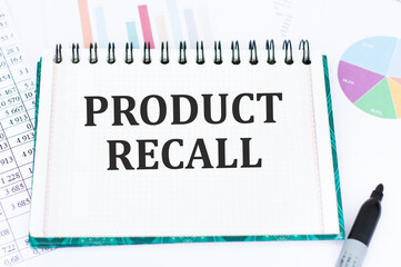 Text Product Recall on notepad with color charts background