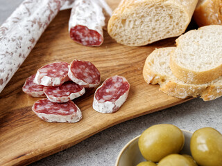 Sliced fuet typical Catalan sausage. Thin dried sausage.