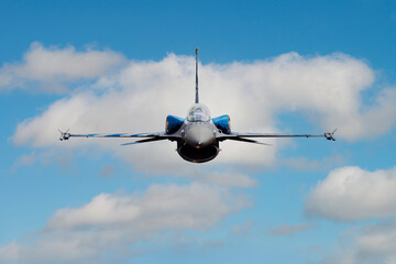 F-16 fighter jet plane in the sky. Military aircraft fly and flying with cloud backgrounds. Air force aviation.