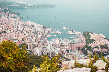 Obraz premium Panoramic view of Monaco, port, bay, buildings and sea coast from mountain top. Beautiful cityscape. Travel Europe. View from above.
