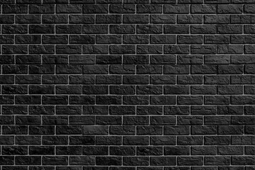 Black brick wall. Modern construction industry. Building's facade.
