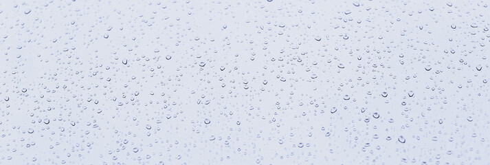 rain water drops on blue background	
