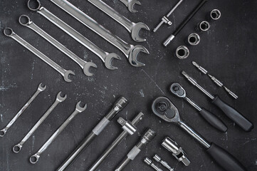 Car repair tools on a dark background. Neat wrench layout