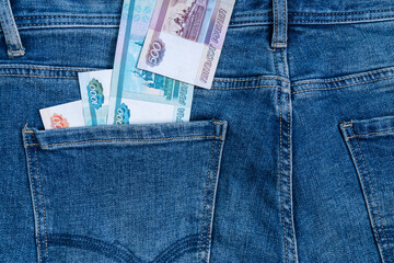 Russian ruble banknotes in the back pocket of jeans. Salary concept