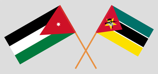 Crossed flags of Jordan and Mozambique. Official colors. Correct proportion