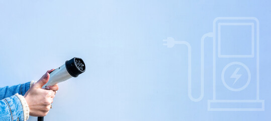 Electric car. Power cable pump plug in recharge fuel technology with cable to power battery. Eco green energy hybrid vehicle on future charger station. Power supply electric car charging technology.