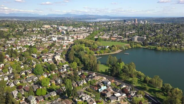 Flying Sideways Along Green Lake with Bellevue and University District on the Horizon near Seattle