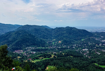 Fototapeta na wymiar View in summer over the Black Forest Baden-Baden under cloudy skies