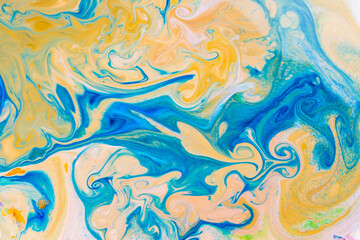 Fototapeta na wymiar Fluid art blue yellow pattern. Abstract ink mixed texture. Psychedelic multicolored background