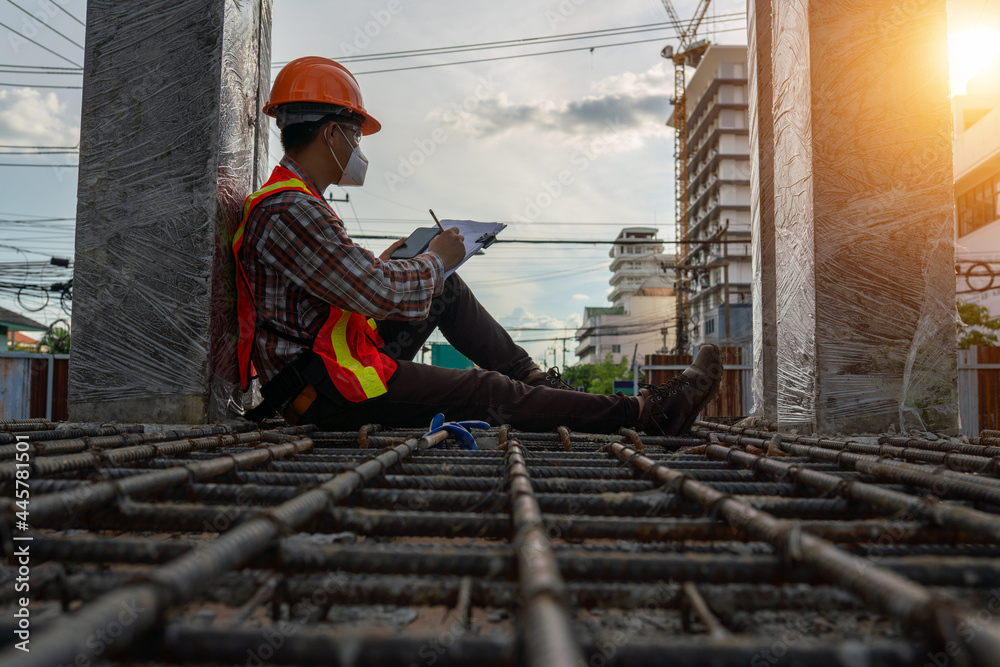 Sticker engineer sitting on the construction site