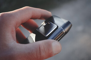 The phone is in the hands of a guy. New technologies.