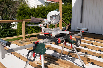 Detail of new terrasse on house with cutting wood machine