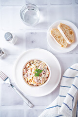Potatoes green peas carrots sausage salad with mayonnaise