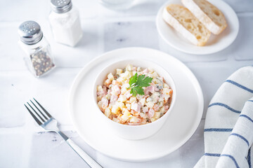 Potatoes green peas carrots sausage salad with mayonnaise