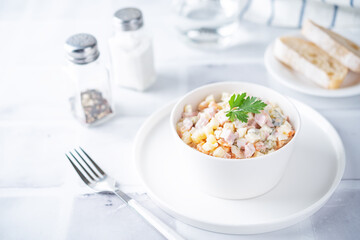 Potatoes green peas carrots sausage salad with mayonnaise